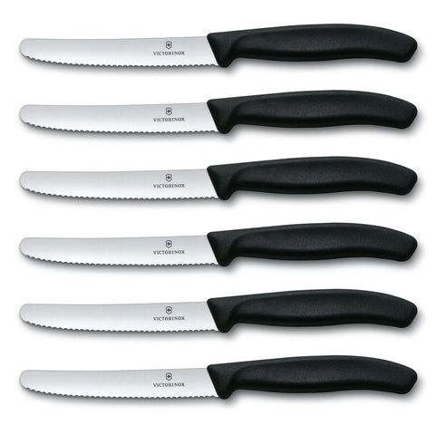 Close-up of Victorinox Swiss Classic serrated blade showing sharp edge