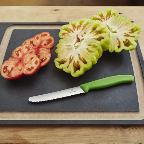 Victorinox tomato knife with green handle, compact size ideal for small produce prep.