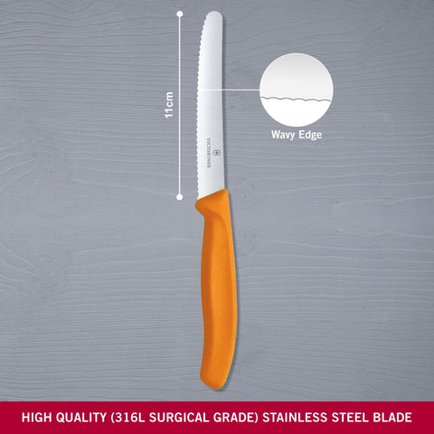 Victorinox Swiss Classic Utility serrated edge close-up, rugged blade for packaging and rope tasks.