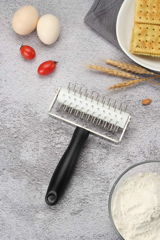 VINMEN AMPSEVEN using dough docker on dough for blister-free crusts.