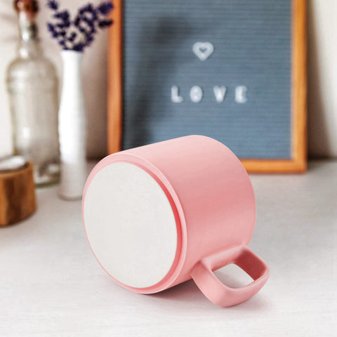 VOBAGA pink mug on a desk, ideal for daily coffee.