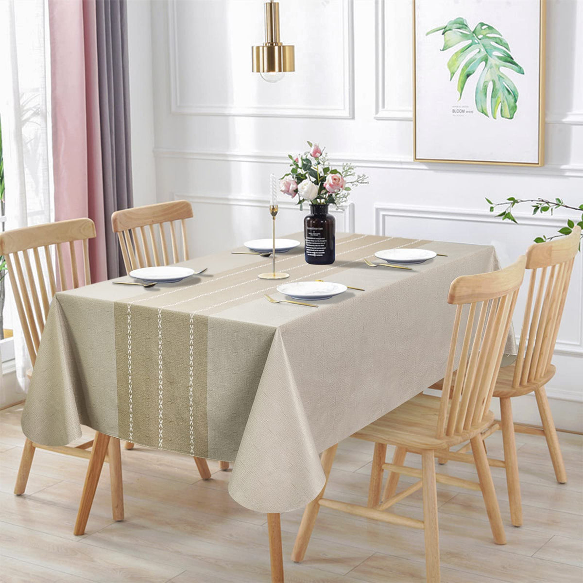 Vonabem waterproof rectangle tablecloth in beige protecting a dining table from spills.