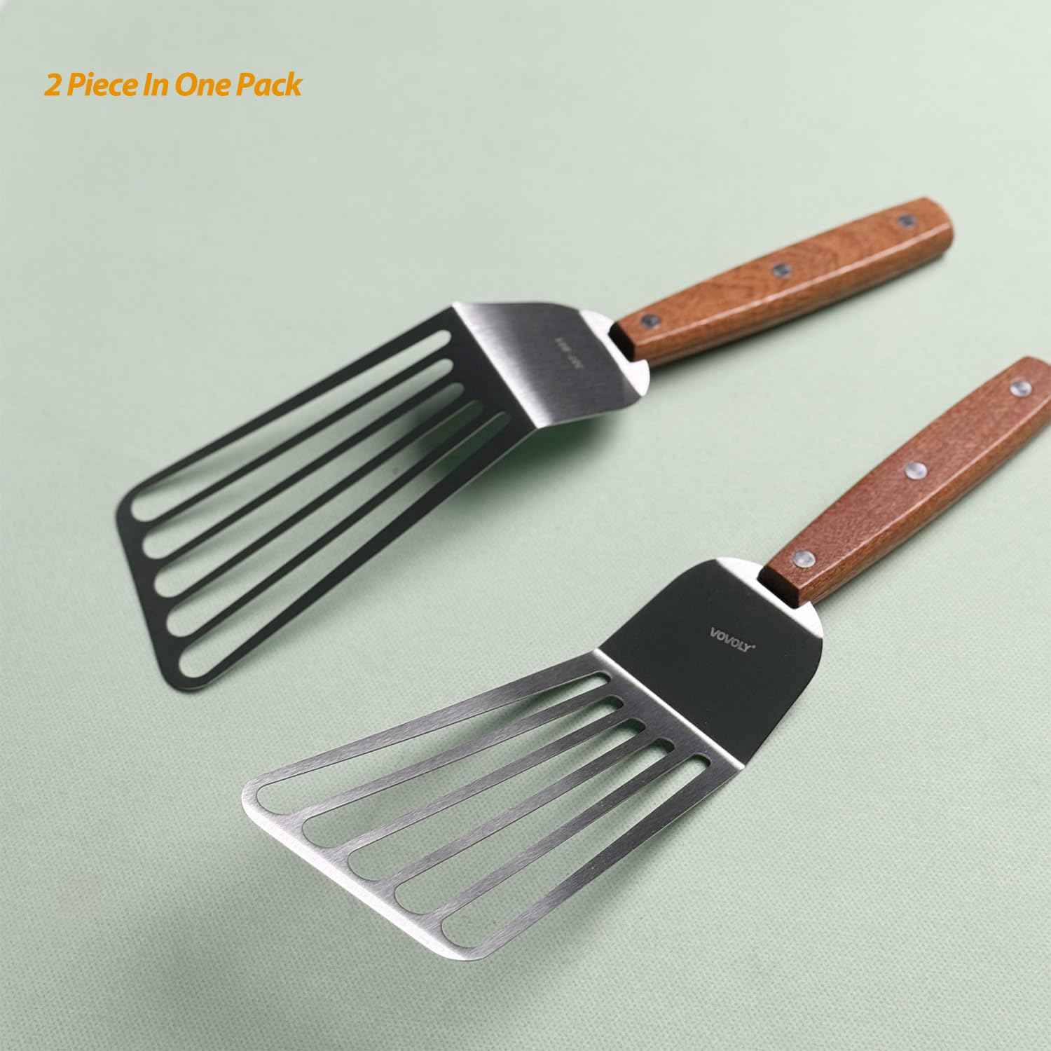 Vovoly beveled edge slotted spatula slides under food with precision.