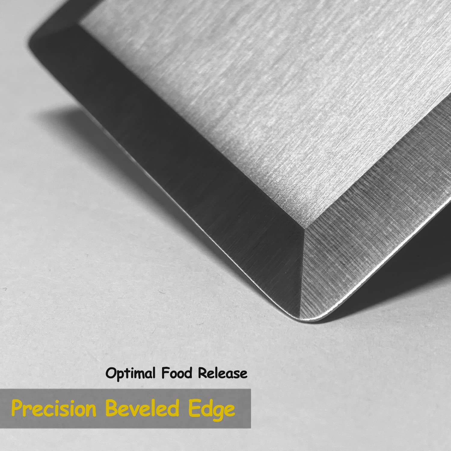 Vovoly spatula on a flat-top grill showing solid leverage and even contact