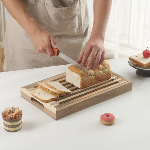 Vzodesr bamboo cutting board doubles as serving tray for fresh bread.