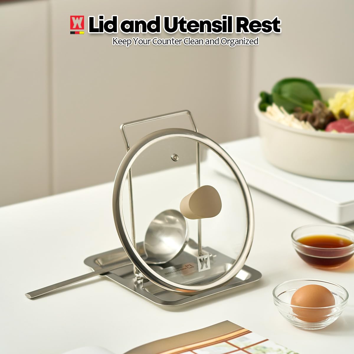 Wagensteiger kitchen organizer stand keeps utensils and lids within reach.