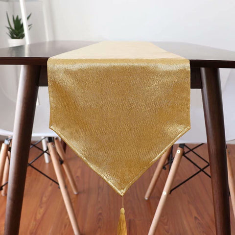 WAITER TREE sparkly gold tassels on a table runner.