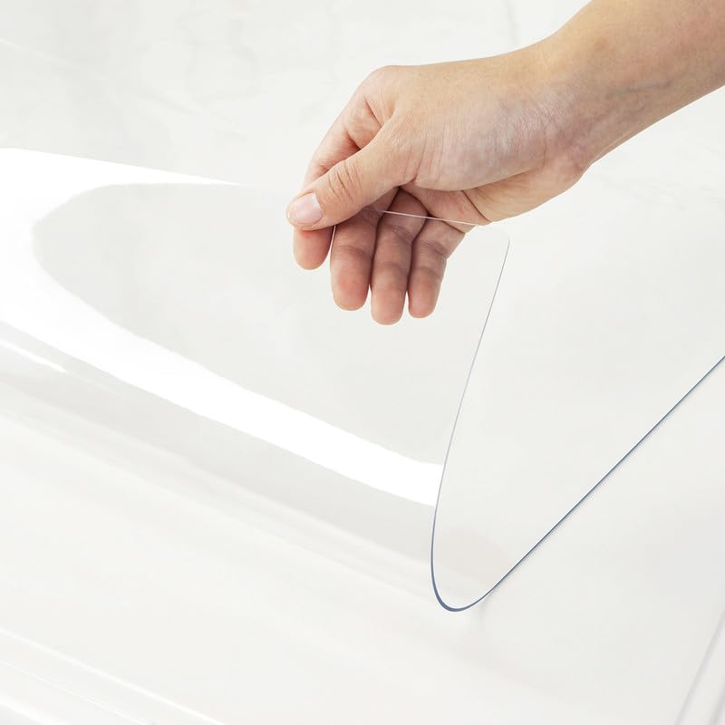 Warmstar clear table cover 36x60 protects a rectangular dining table from spills and scratches.