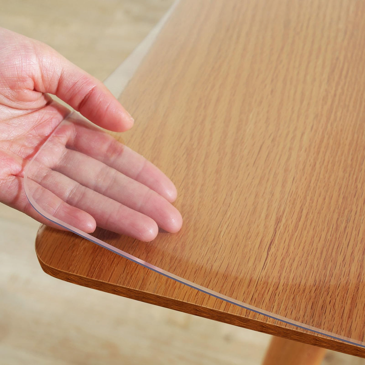 Warmstar clear table cover on dining table showing transparent protection against spills