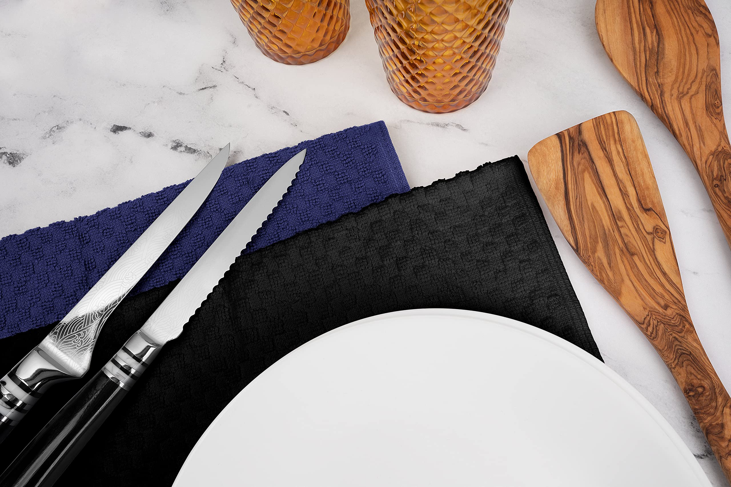 Wealuxe folded display shows a timeless black towel design.