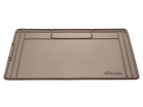 WeatherTech SinkMat with raised lip traps leaks and spills under the sink.