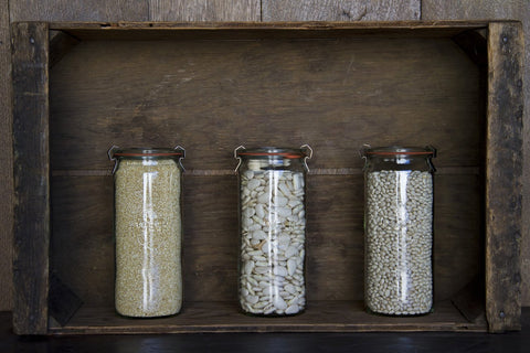 WECK 763 jars with clamps seal airtight beverages during service.