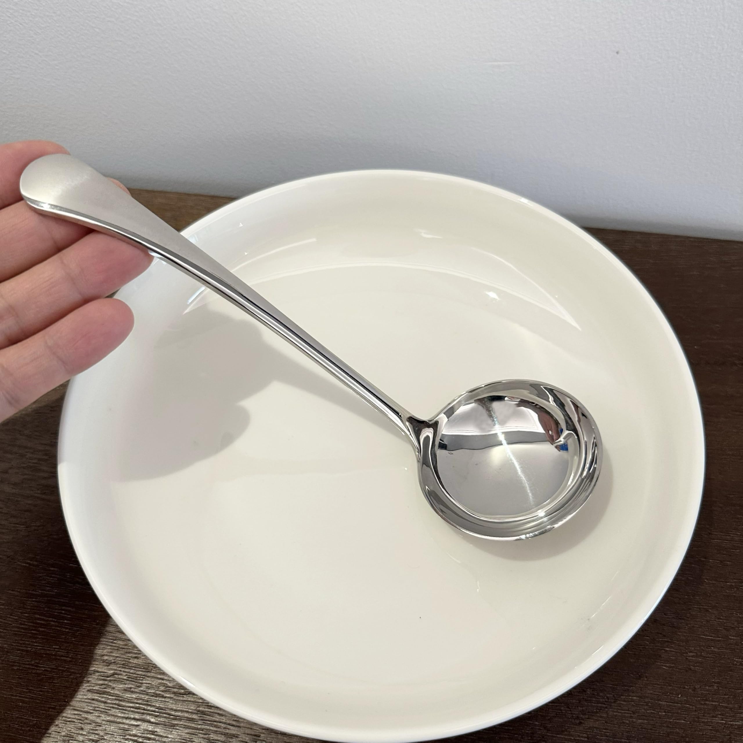 Wenkoni soup ladle serving in a bowl for portions.