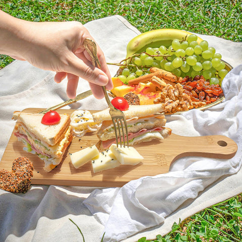 WHEATHUSK cutting board used for breads, vegetables, and pizzas during prep.