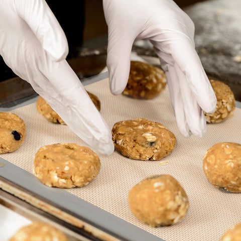 Whisrvival silicone mats in oven up to 480°F for versatile baking.