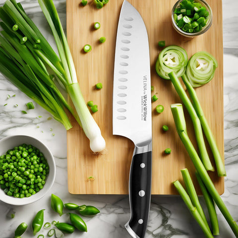 WICKWILLOW Velina Santoku hollow edge close-up, reducing food sticking for smoother prep.