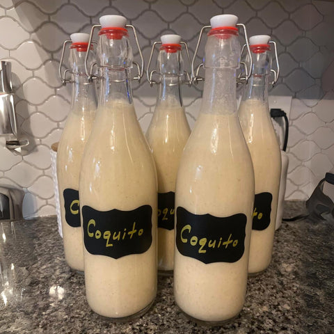 Six-pack WILLDAN swing top bottles in a neat kitchen setup.