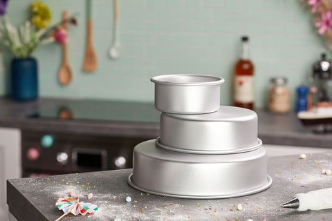 Wilton aluminum round cake pan 6-inch ideal for tiered cakes and precise baking.
