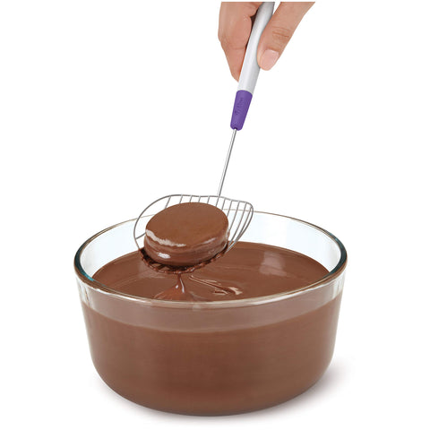 Wilton Candy Melts scoop shows wide slots to stabilize treats during dipping