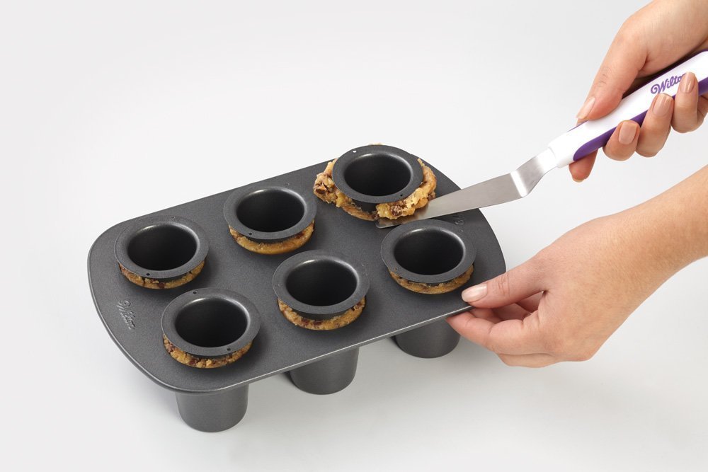 Wilton cookie shot glass pan inserts used to form precise shot glass cups.