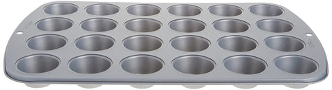 Wilton mini muffin pan showing heavy-gauge construction for durable browning.