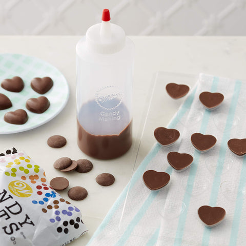 Wilton Regular Melting Squeeze Bottle close-up showing microwave-friendly candy melting.