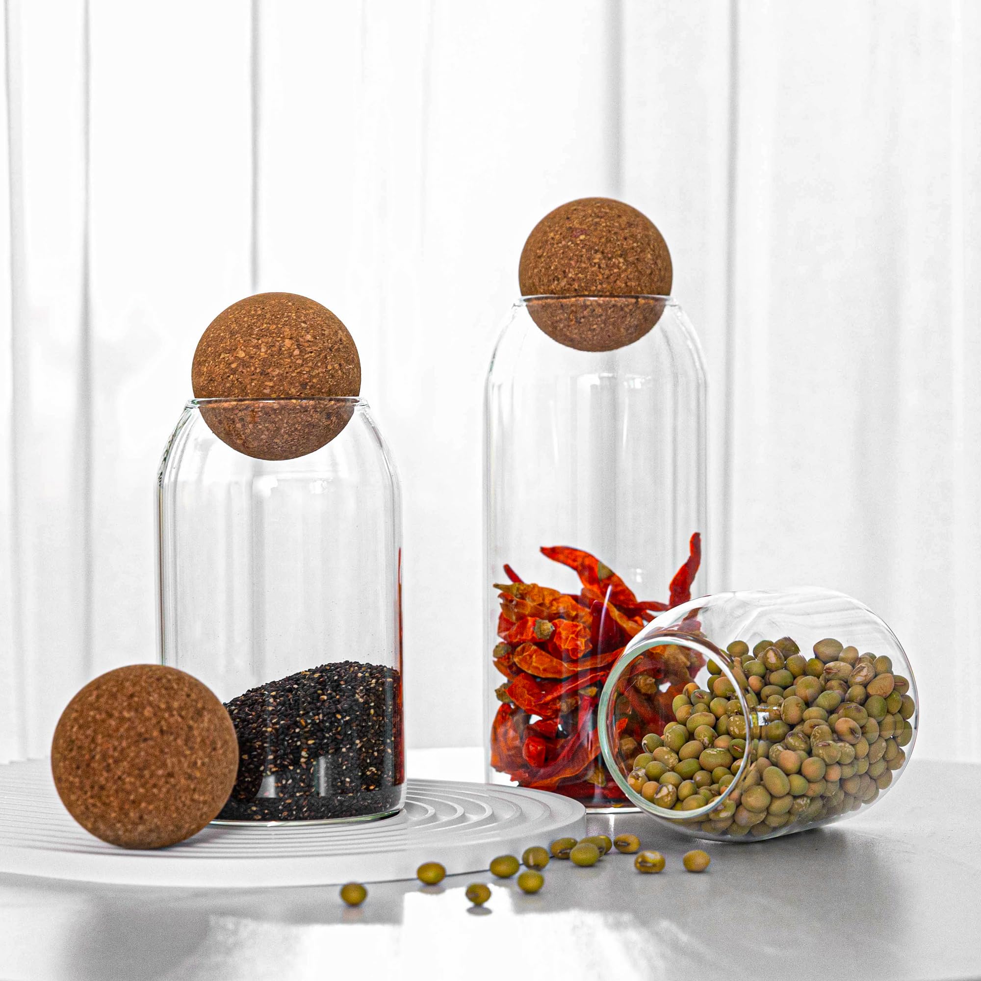 Wisifayardin clear glass jar on display ideal for coffee beans or spices on a shelf.