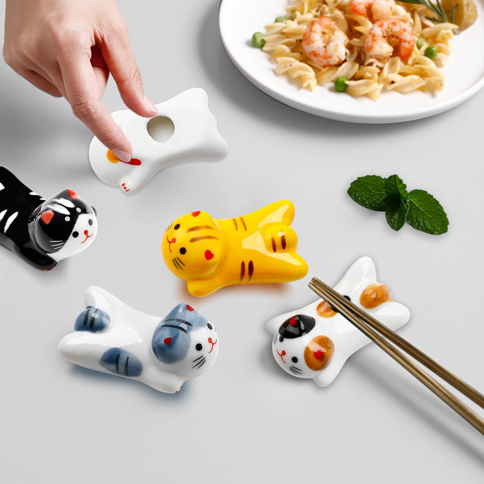 Woerma cat-chopstick-rest-style-e compact rest holds forks or spoons.