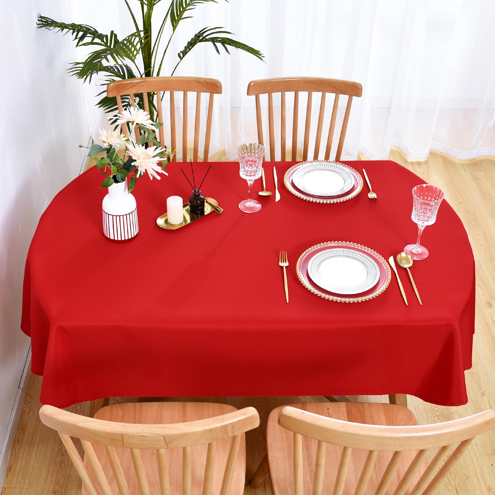 Wolkemer red oval table cover with hem edges for a clean finish.