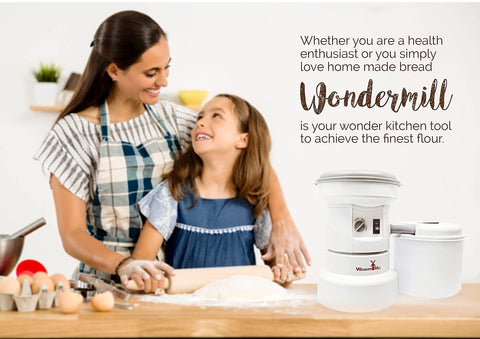 WonderMill filtration tube in use reduces flour spills during grinding.