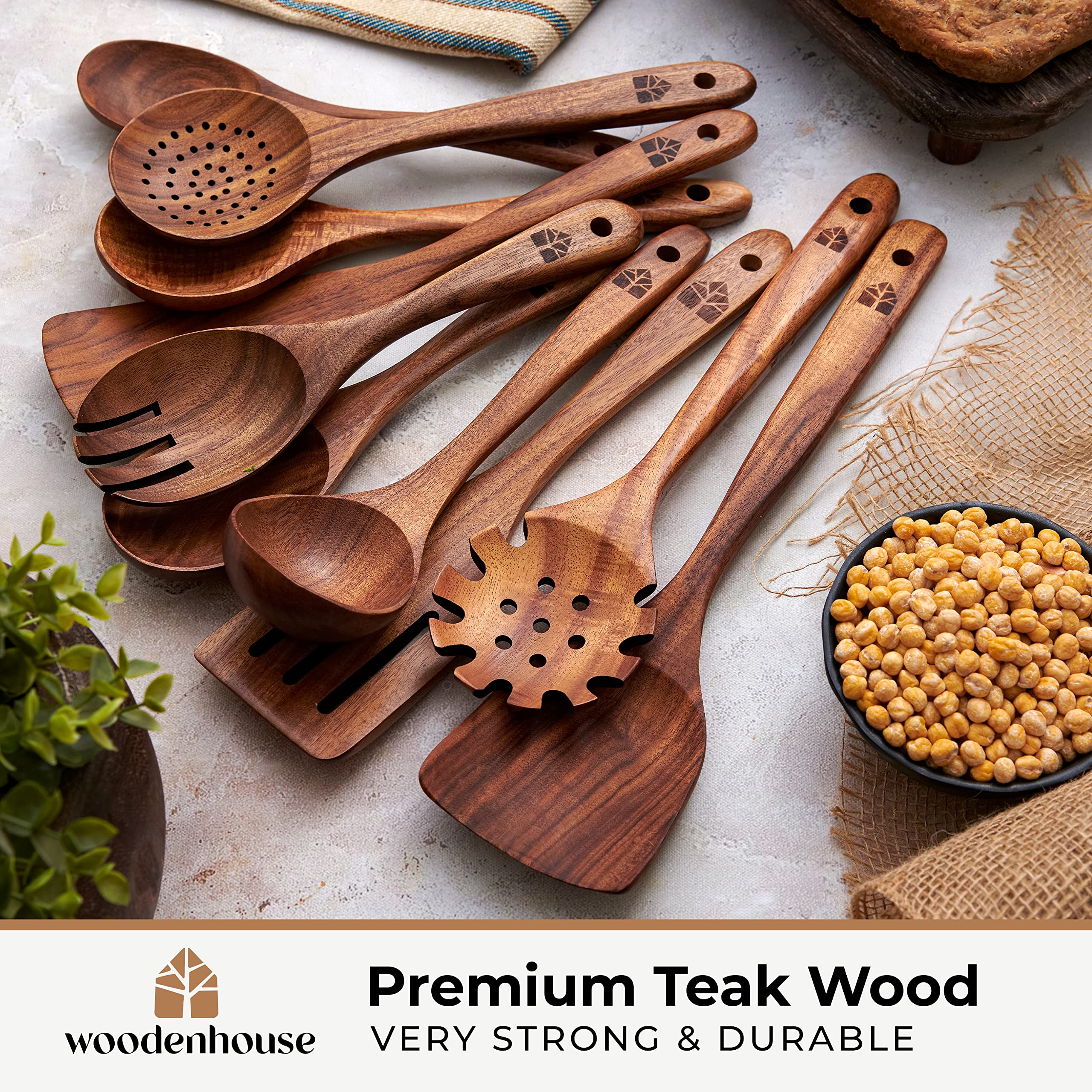 Woodenhouse teak slotted spatula reduces scratching and drains liquids while lifting.