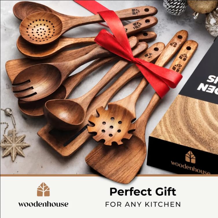 Woodenhouse teak wok spatula with sturdy edge for stir-frying and turning ingredients.