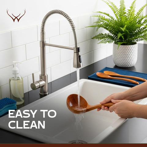 Woodlands USA teak ladle for serving and stirring in bowls.
