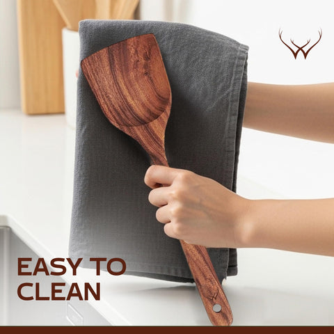 Woodlands USA teak spoon set with pasta spoon for even mixing and serving.