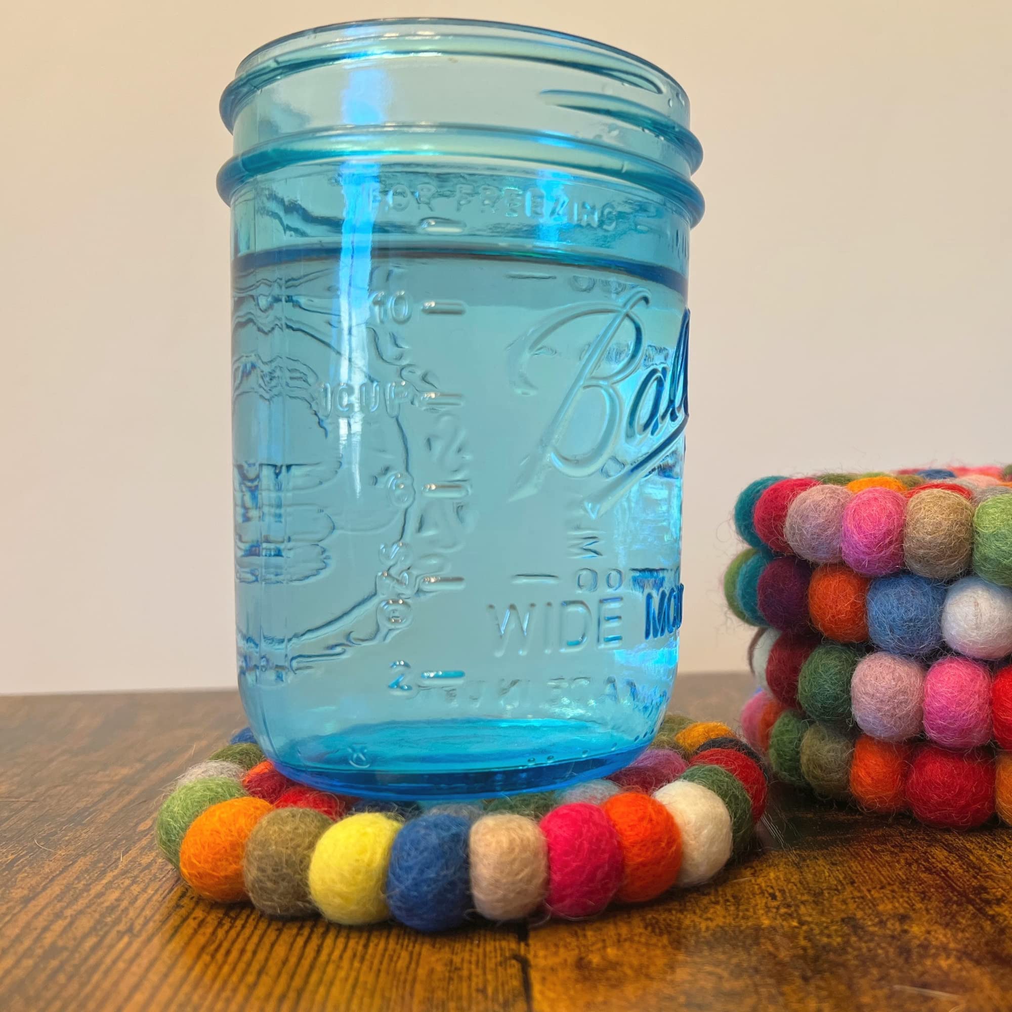 Woolygon round coasters easy to clean and stack neatly