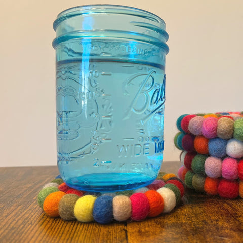 Woolygon round coasters easy to clean and stack neatly
