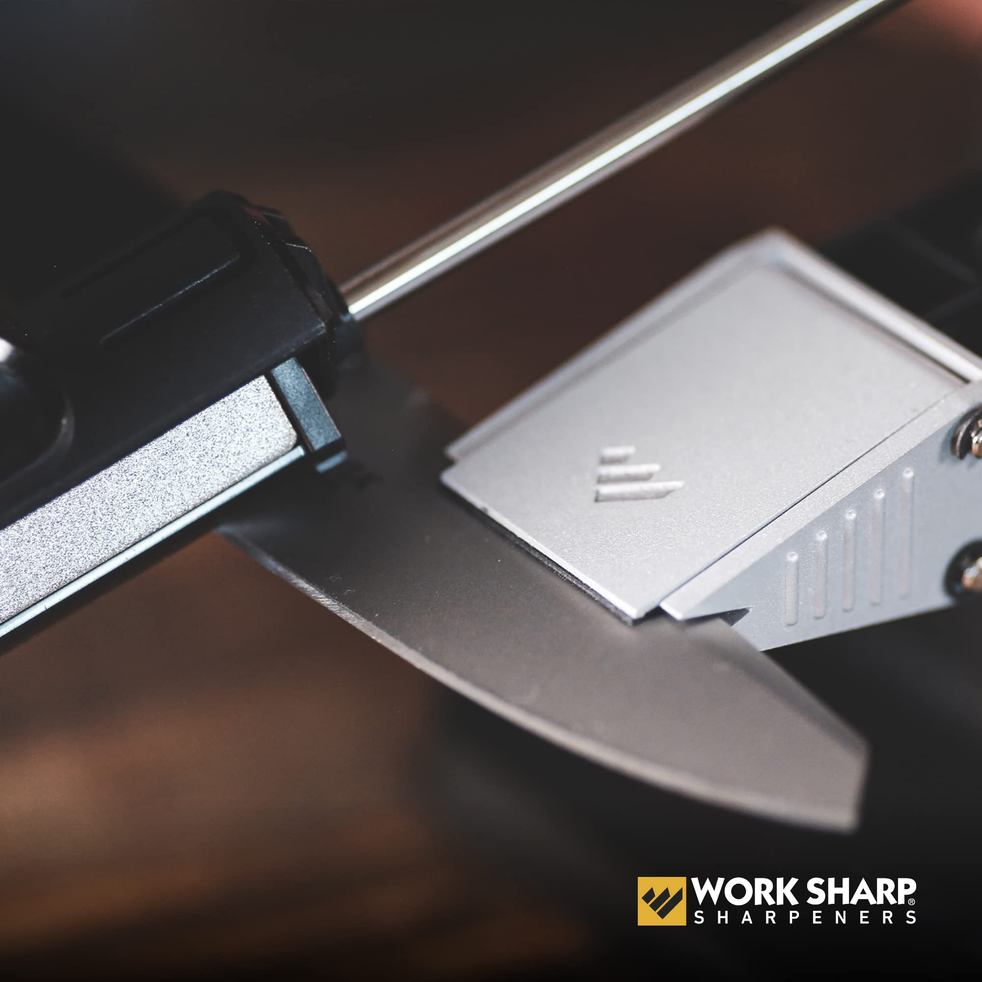 Work Sharp sharpener demonstrating safe, stable grip on a blade