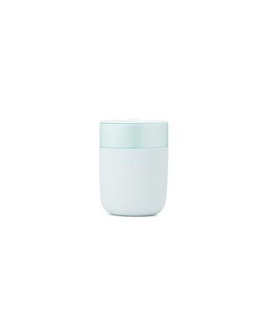 W&P Porter ceramic mug with mint silicone sleeve offers a comfortable grip.