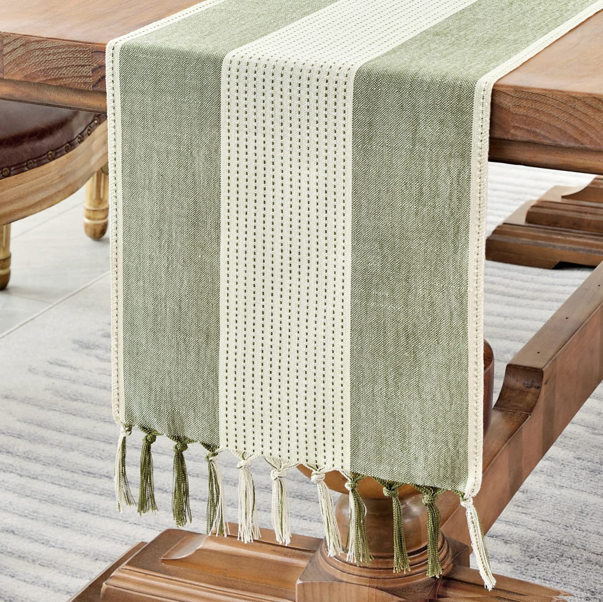 Wracra linen table runner in sage green enhances rustic dining ambiance.