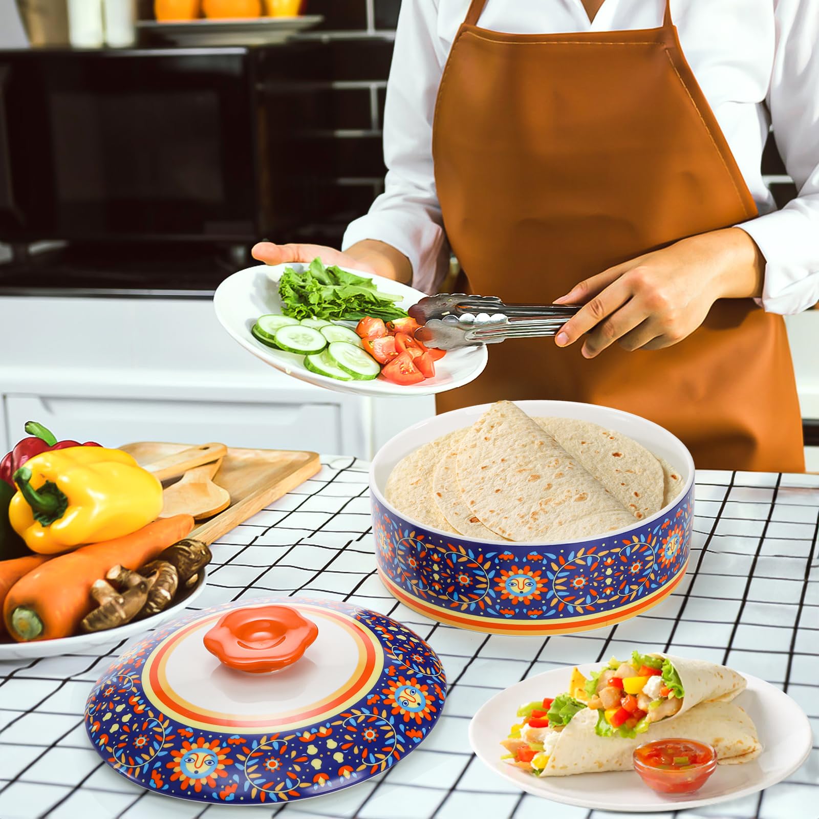 Patterned ceramic tortilla keeper designed for tacos, pancakes, and chapati at gatherings.