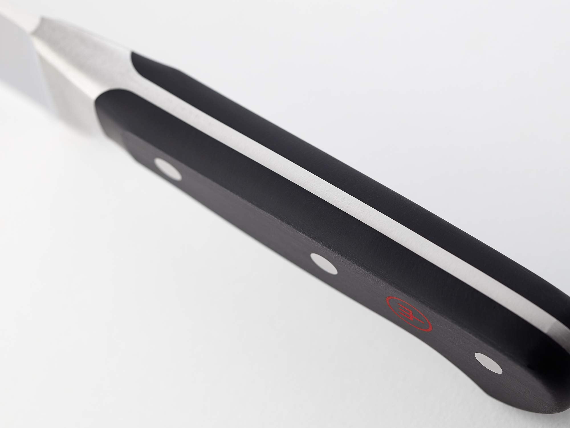 Wüsthof Classic boning knife 6-inch blade close-up highlighting clean cuts.