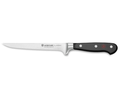 Wüsthof Classic flexible boning knife 6-inch black blade close-up for precise trimming.