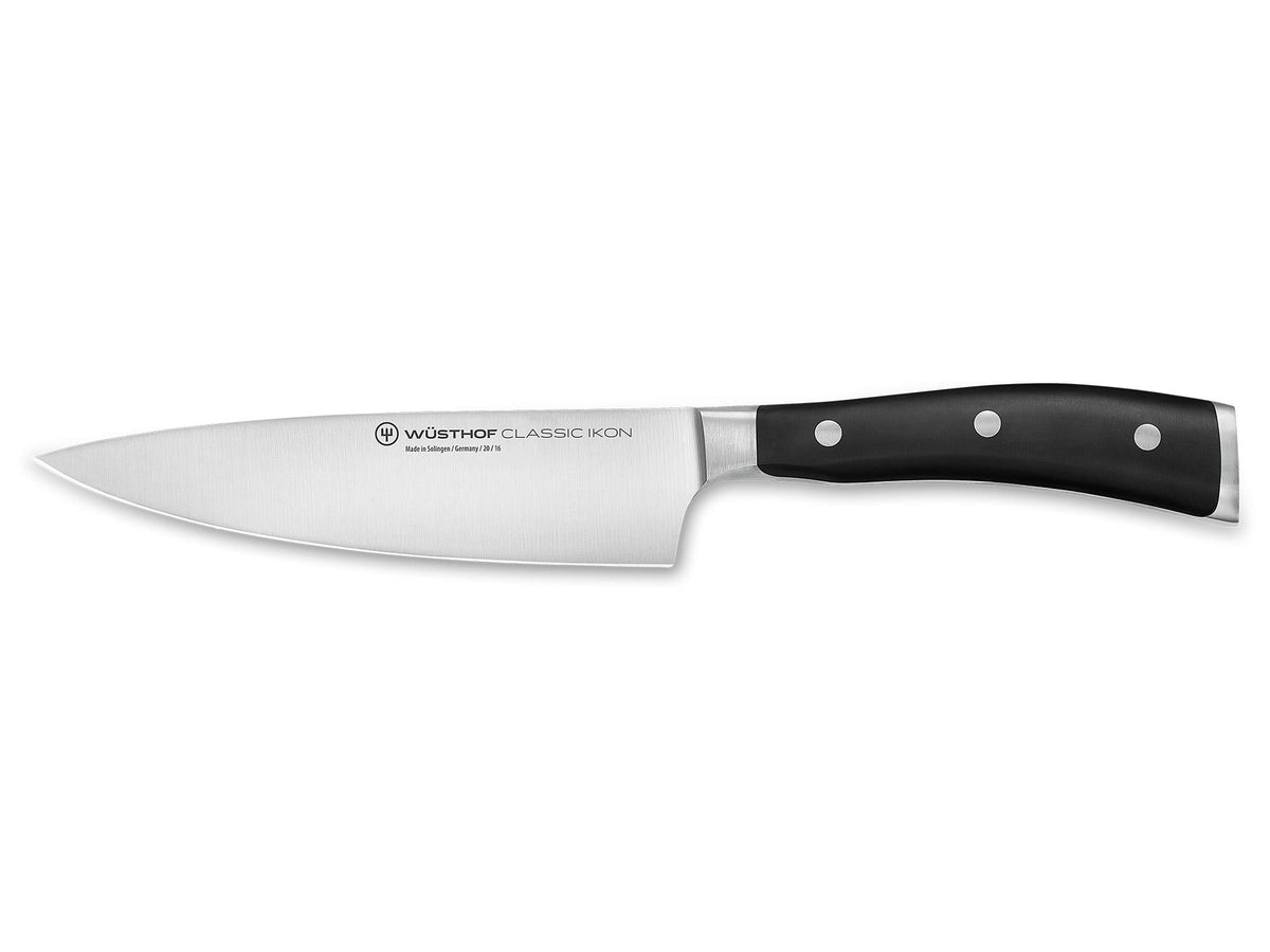 WÜSTHOF Classic IKON 6-Inch Chef's Knife blade close-up for precise slicing and even cuts.