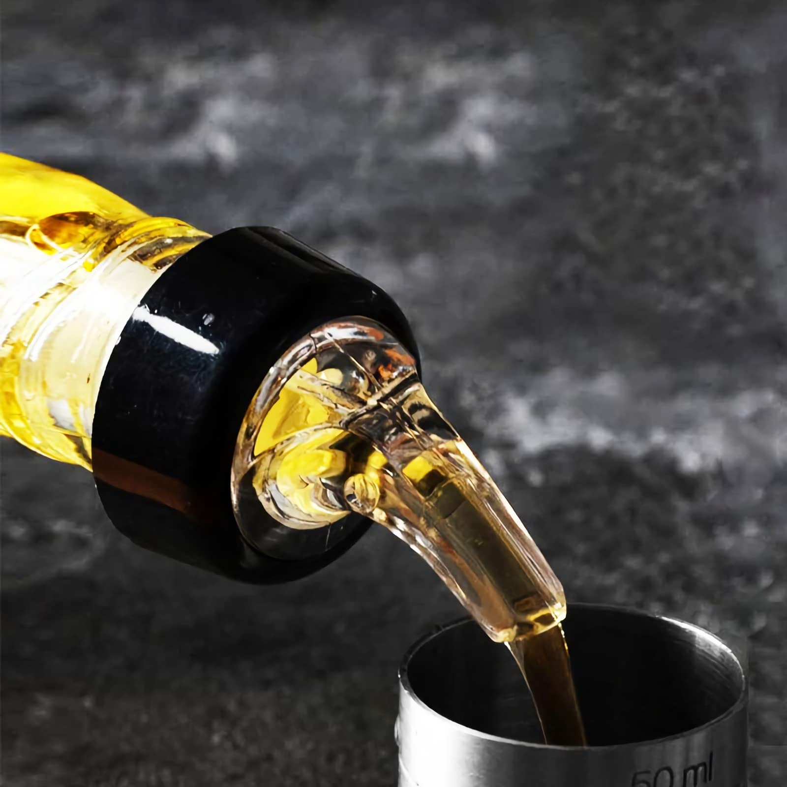 WUWEOT pourer inserts and removes easily from bottle neck.