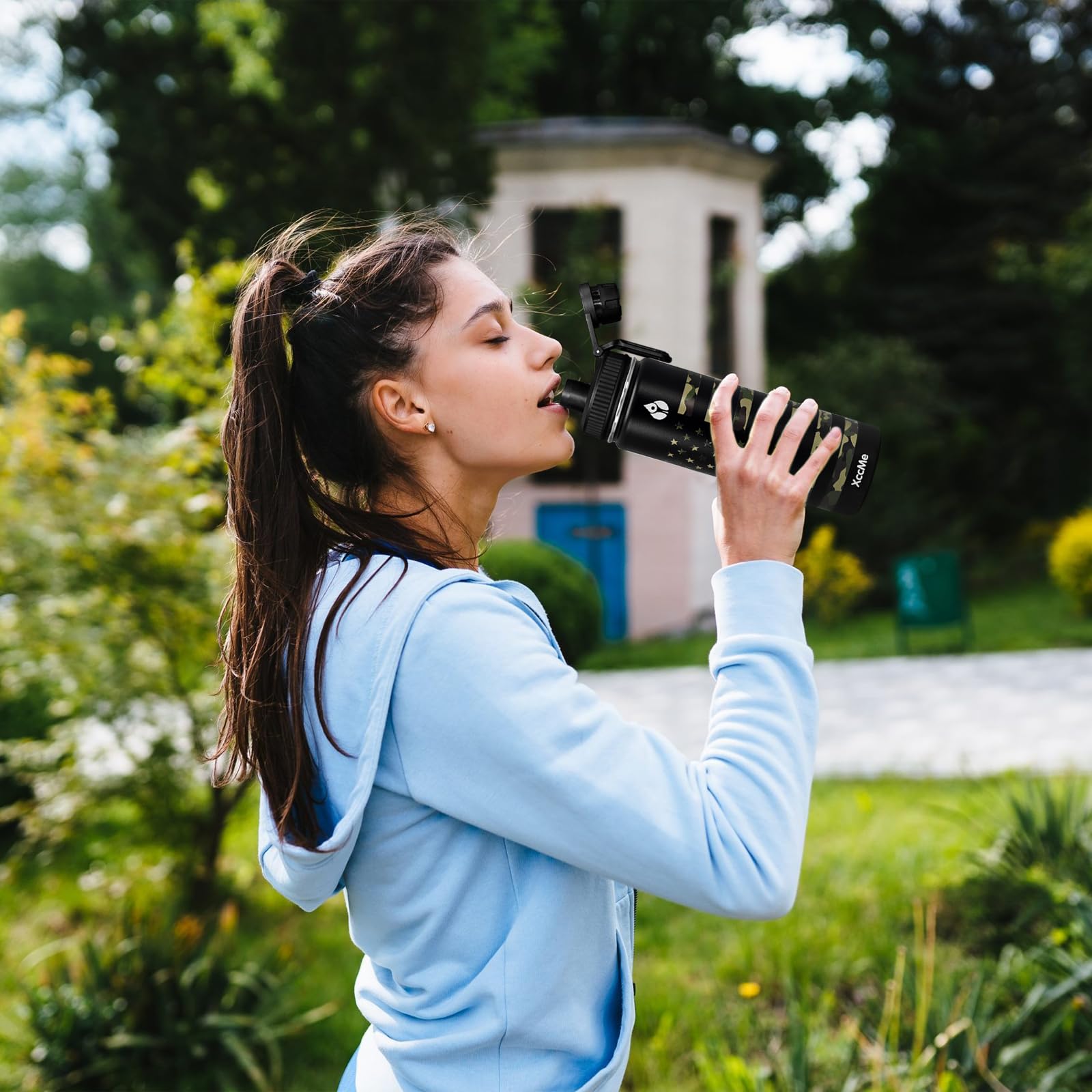XccMe bottle in outdoor setting highlighting leak-proof performance for travel and hiking.