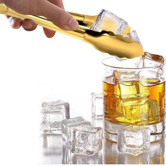 XEVOM gold tongs at wedding buffet highlighting premium tableware.