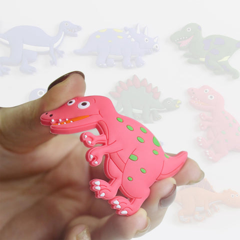Dinosaur magnet sticks firmly to fridges and whiteboards for notes.