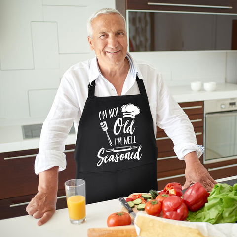XLSXEXCL apron on a man cooking, highlighting comfortable daily wear.