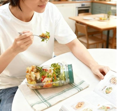 Xpcpekt salad jar with side opening showing dressing compartment for on-the-go meals.