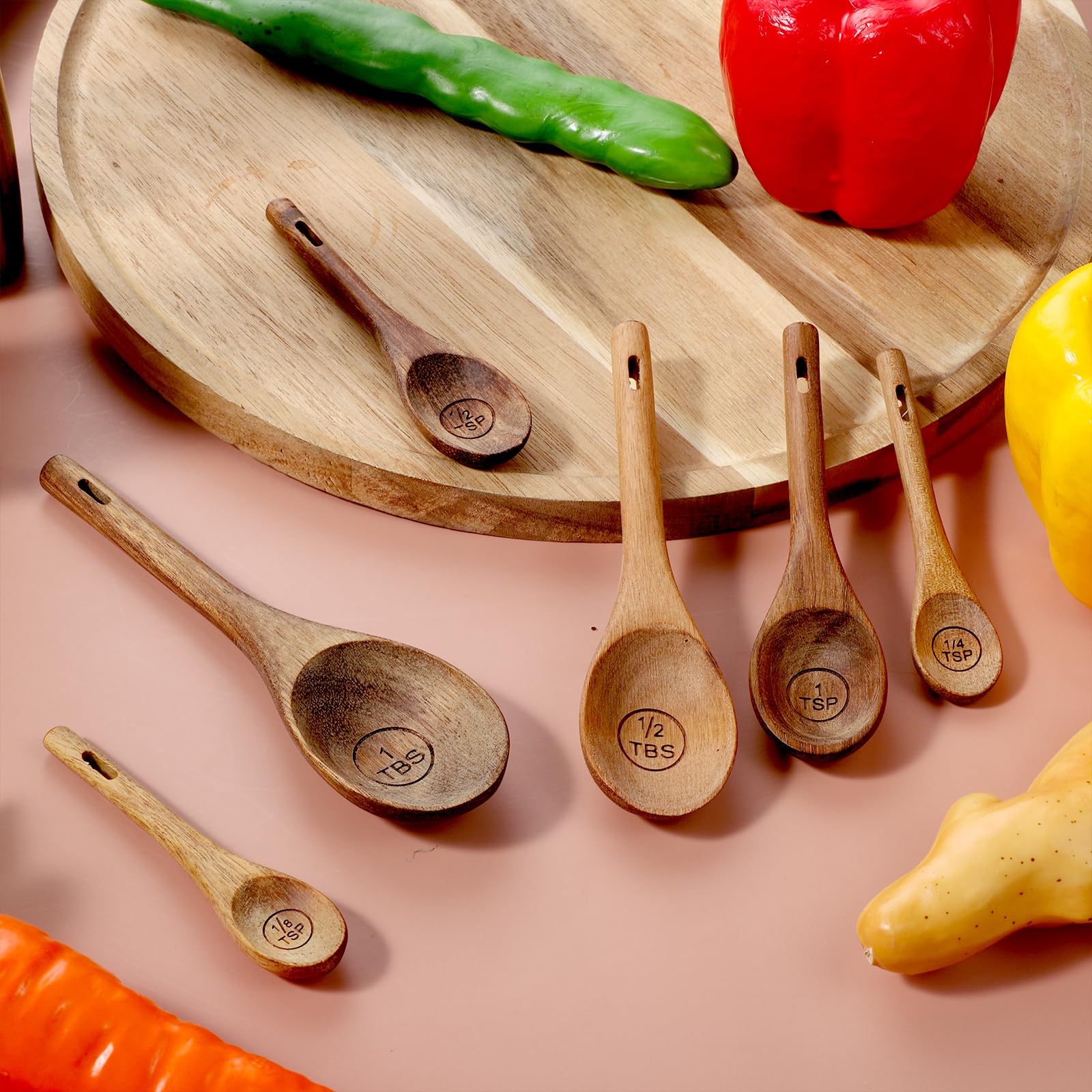 Xyembu oval spoon head in small containers for precise scooping.